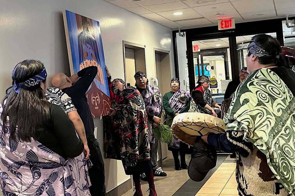 Carrielynn Victor helps install her new artwork with a CGH staffer at the gathering to honour Keegan Combes at CGH on Feb. 21, 2026. (Jennifer Feinberg/ Chilliwack Progress)