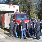 The public helped Hope firefighters push the new fire apparatus into Fire Hall 3 in Hope on Feb. 28, 2026. (Kemone Moodley/Hope Standard)